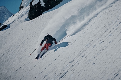 Skier going downhill in the backcountry